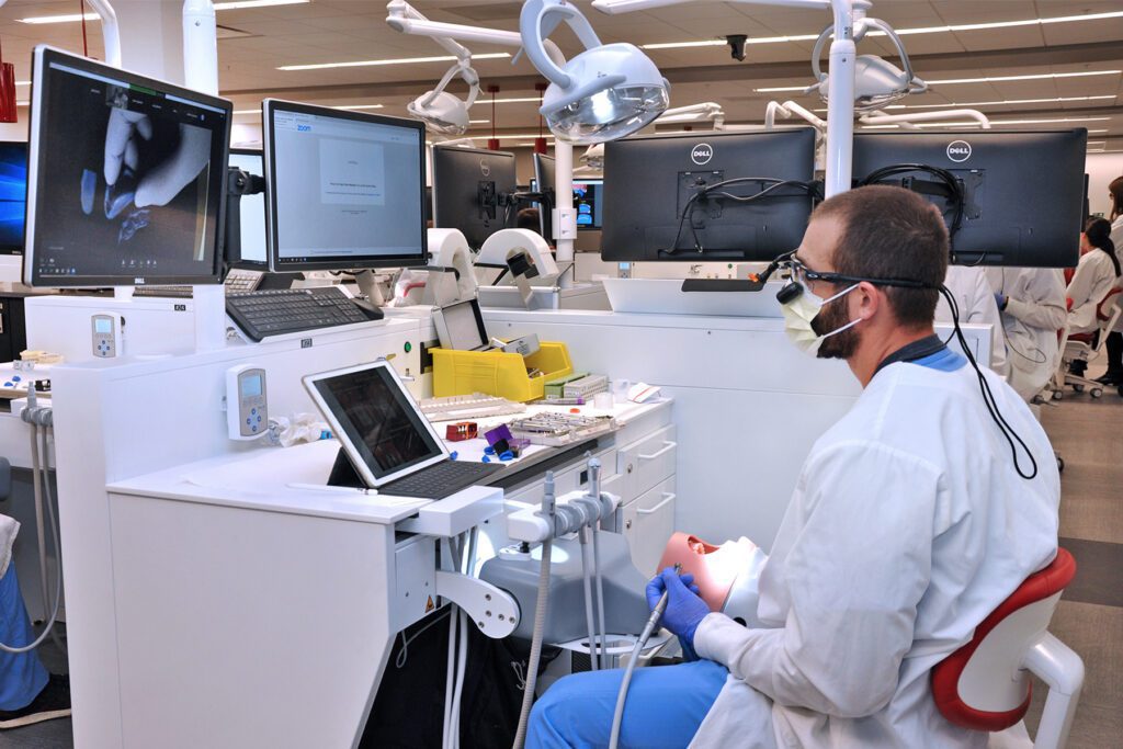Dental student working in the simulation lab