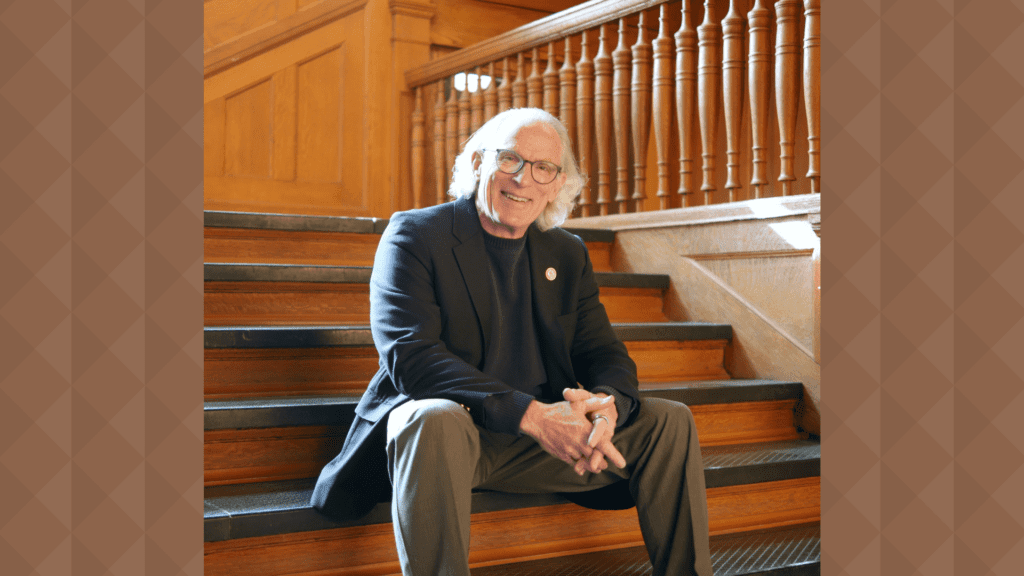 Richard Griffin sitting on stairs