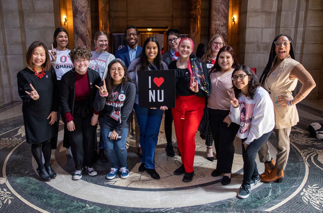 Chancellor Li and UNO students pose for a photo while celebrating I Love NU Day at the Nebraska State Capitol Building in Lincoln, Nebraska on Wednesday, April 5, 2023.