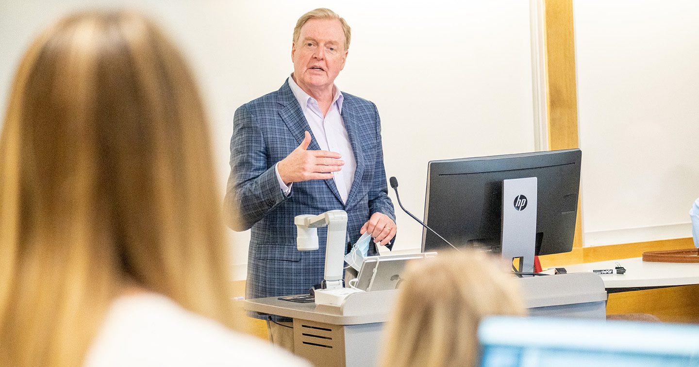 Doug Waggoner talks with students in the Investors With Purpose program.